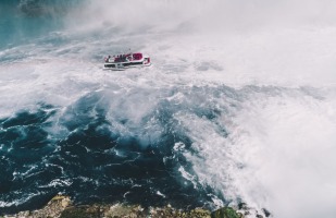 a boat navigating rough waters.