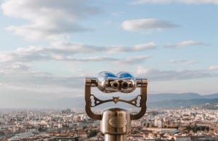 binoculars overlooking a city. 